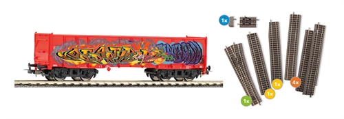 Piko 55380 Rail extension set with Eaos freight car with graffiti and rails with ballast